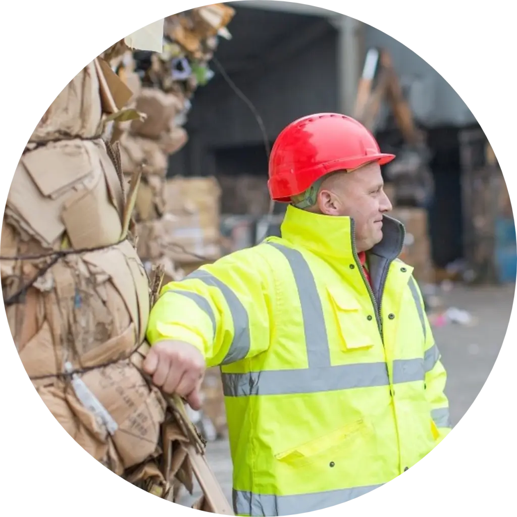 james-redfern-leaned-against-cardboard-bale-looking-away