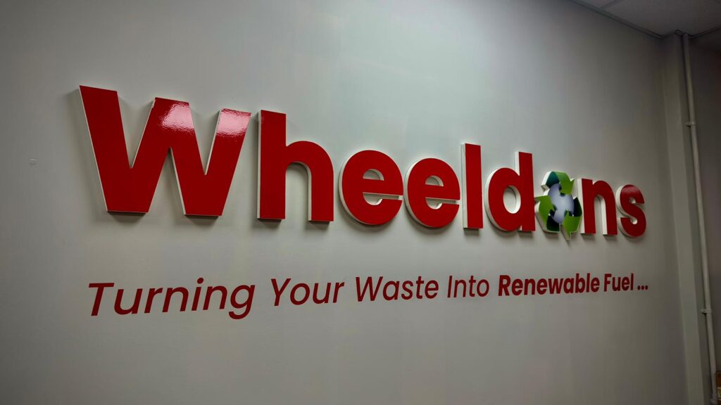 A red sign spelling the companies name "Wheeldons".